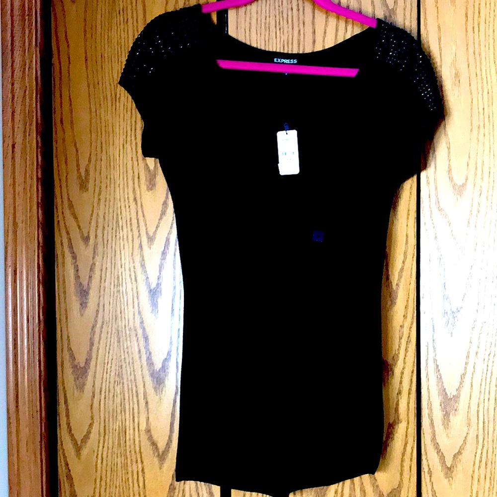 Black top from Express with beading on the shoulders new with tags.